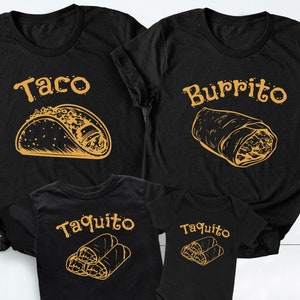 May include: A set of four black t-shirts with a Mexican food theme. The shirts feature the words "Taco", "Burrito", and "Taquito" in yellow text. Each shirt has a graphic of the corresponding food item.