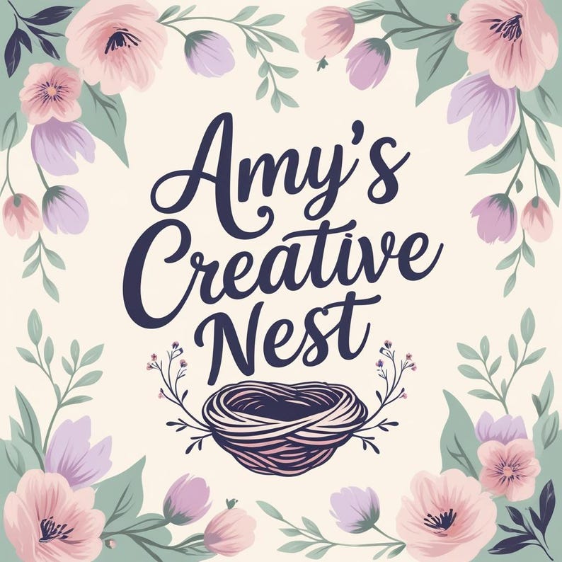 May include: A decorative floral design featuring the text "Amy's Creative Nest". The image includes pink and purple flowers, green leaves, and a nest illustration, set against a cream background.