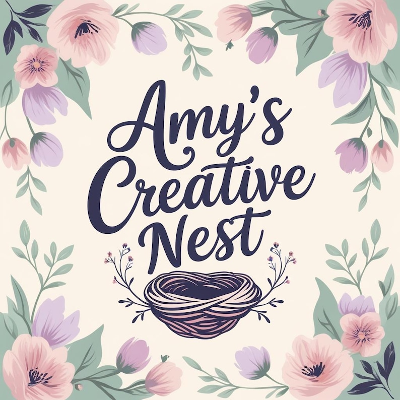 May include: A floral design with the text "Amy's Creative Nest" in a cursive font. The design features pink and purple flowers, green leaves, and a nest illustration, all set against a cream background.