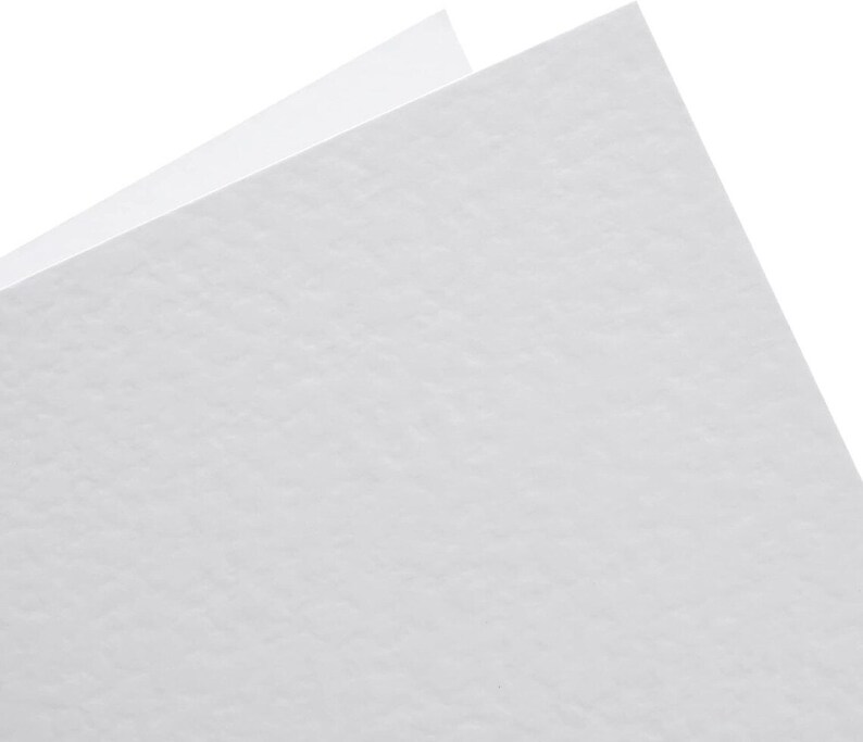 May include: A white textured sheet of paper.