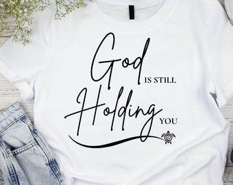 God Is Still Holding You PNG | Christian Encouragement Shirt Design | Faith Download