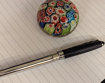 Small Millefiori paperweight canes polished bottom.