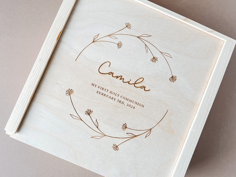 Crafted with care, this wooden keepsake box is a timeless treasure perfect for celebrating a holy first communion.