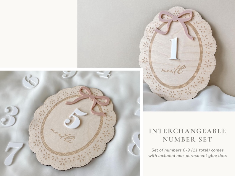 May include: An oval wooden milestone plaque with a scalloped edge, a dusty pink bow, and a white number. The plaque features laser-cut floral details and the word month or months. The set includes interchangeable white numbers from zero to nine.