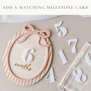 This set is an ideal way to document each milestone, from the first month to the twelfth, in a baby girl's journey.