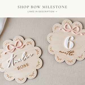 Cherish the memories of your baby girl's growth journey with our charming pink bow milestone card, a symbol of love and celebration.