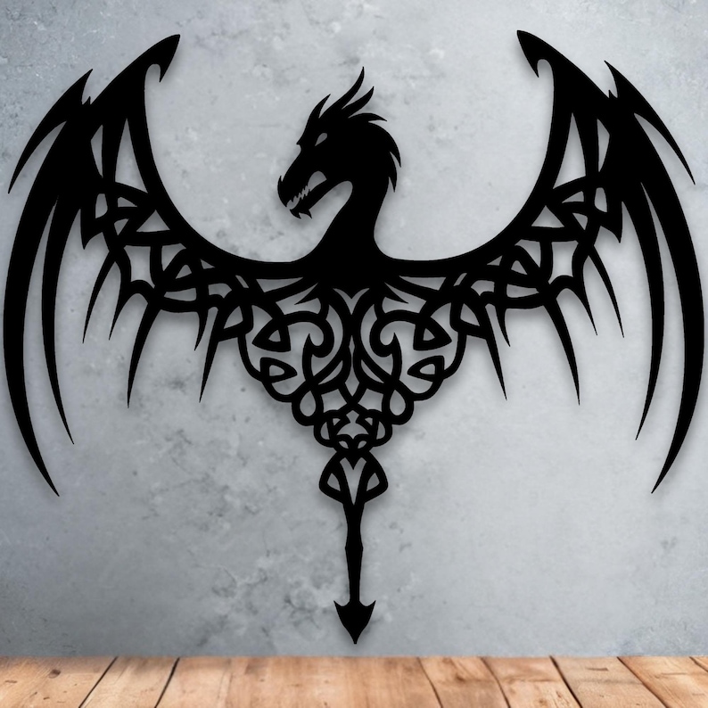 A black silhouette of a dragon with intricate, swirling patterns on its wings and tail.