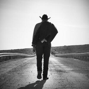 Dirt Road Cowboy&#39;s Silhouette