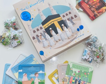 May include: A colorful illustrated book titled "The 10 Blessed Days of Dhul Hijjah!" with a blue, white, and yellow color scheme. The book features a depiction of the Kaaba, a central structure in Islam, surrounded by people in white robes. The book is accompanied by several puzzle pieces and cards, all with Islamic themes.