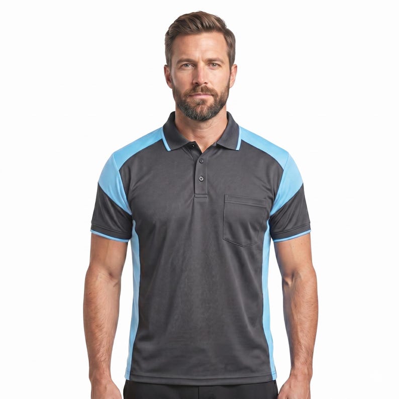 May include: A short-sleeved polo shirt featuring a dark charcoal gray main body with contrasting light blue panels along the shoulders and sides. The shirt includes a classic collar, a three-button placket, and a single chest pocket on the left side.