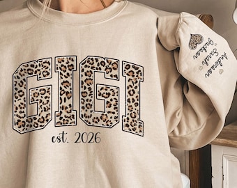 Custom Leopard Gigi Sweatshirt With Kid Name On Sleeve, Personalized Gigi Sweatshirt, Gift For Gigi, Christmas Gift Gigi Est 2025 Sweatshirt