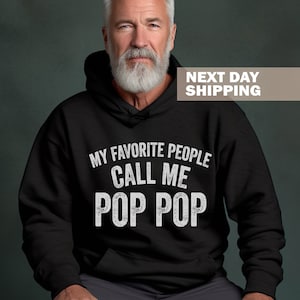 May include: Black hooded sweatshirt with white text that reads "My favorite people call me Pop Pop".