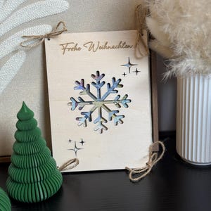 Weihnachts-Holzkarte mit Schneeflocke für Geldgeschenk