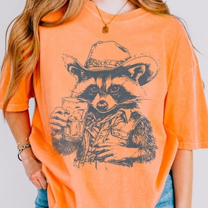 Retro Cowboy Raccoon Graphic Tee - Funny Western Shirt