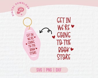 May include: A pink keychain with a motel key tag design that says "Get in we're going to the book store" with red hearts. The text is in a handwritten font.