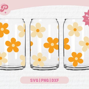 May include: Three glass can wraps with a retro flower pattern in orange and cream. The wraps are designed for 16oz and 20oz cans. "Glass Can Wrap 16oz & 20oz" is written on a pink star.