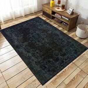 May include: A dark blue and green area rug with a floral pattern. The rug has a distressed look and is made of a soft, durable material.