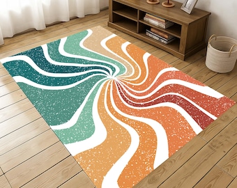 May include: A rectangular area rug with a retro design. The rug features a swirling pattern of white, teal, orange, and red-orange stripes radiating from a central point. The rug has a distressed, textured appearance, adding to its vintage aesthetic.