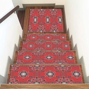May include: Red and black patterned stair treads with a floral design. The treads are made of a soft, durable material and are easy to clean.