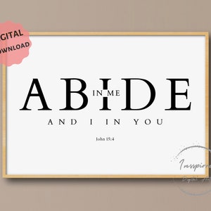 Op de afbeelding: Zwart-witte printbare wandkunst met de tekst "ABIDE IN ME AND I IN YOU" en de bijbelverwijzing "Johannes 15:4".
