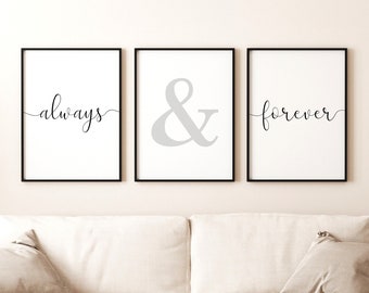 May include: Three framed wall art prints with black frames. The prints feature the words "always", an ampersand, and "forever" in a cursive font on a white background. The art is displayed above a white sofa.
