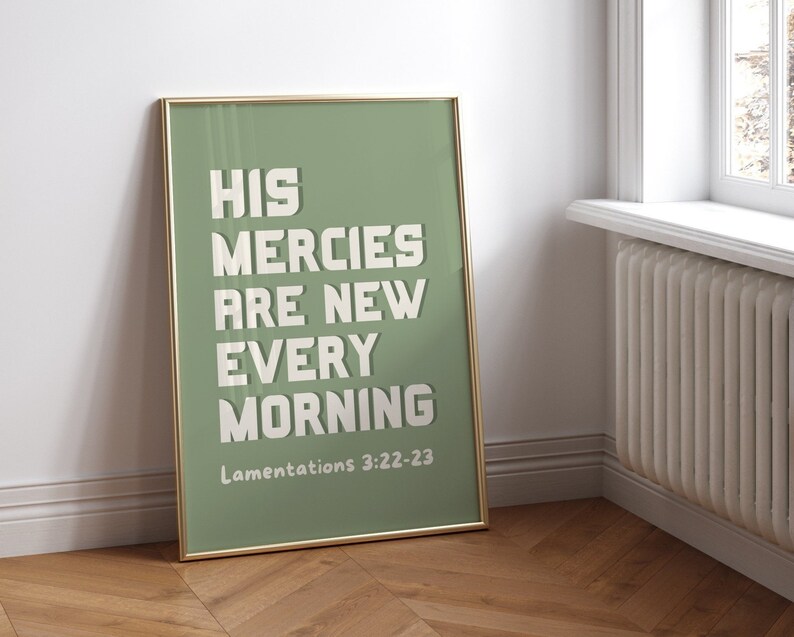 May include: A framed print with a green background and white text that reads "His mercies are new every morning" with the scripture reference "Lamentations 3:22-23" below the text.