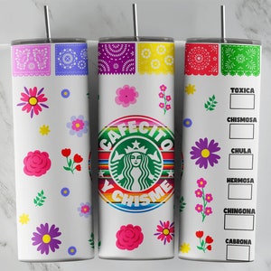 May include: Three white tumblers with colorful designs. The center tumbler features a green Starbucks logo with the text "Cafecito y Chismes". The tumblers are decorated with flowers and paper cutouts.