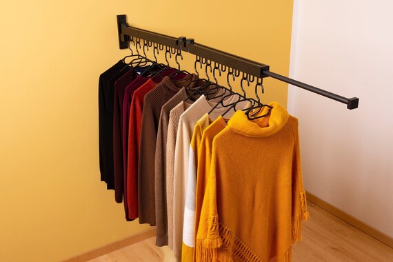 Extendable wall online mounted clothes rail