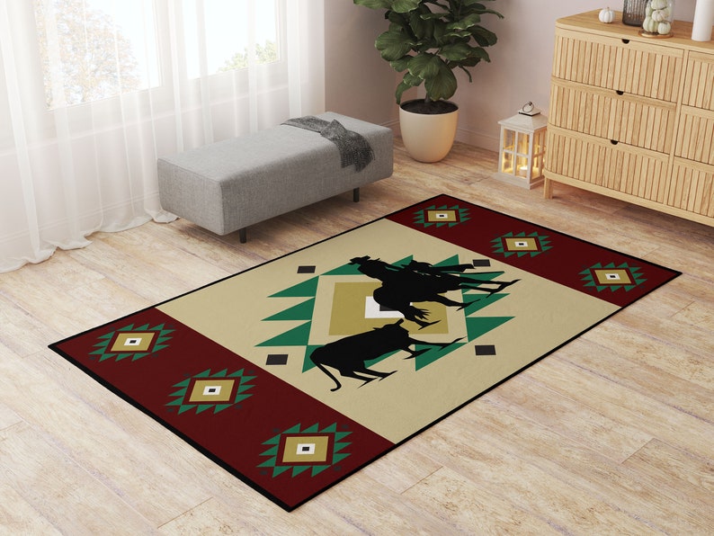 May include: A beige, red, and green area rug with a southwestern design. The rug features a geometric pattern with a silhouette of cowboys riding horses in the center.