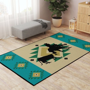 May include: A turquoise and beige area rug with a geometric pattern. The center of the rug features a silhouette of a cowboy riding a horse with two other cowboys walking behind him.