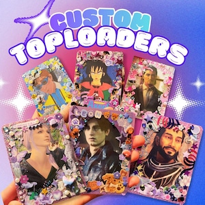 May include: A hand holding six custom top loaders, each decorated with images and embellishments. The top loaders feature various characters and are adorned with stickers, gems, and other decorative elements. The text "CUSTOM TOPLOADERS" is at the top.
