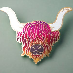 May include: A colourful, hand-painted wooden cutout of a Highland cow with a pink, orange and yellow gradient. The cow's horns are white and the background is a light green.
