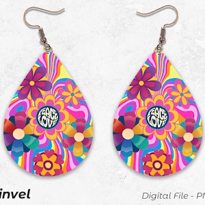 May include: A pair of teardrop-shaped earrings with a colorful psychedelic pattern featuring flowers, swirls, and the words "Peace Love".