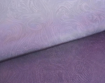 May include: Two pieces of fabric, one a light purple with a marbled pattern and the other a darker purple with a subtle texture.