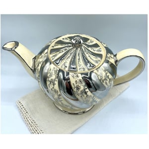 Tetera de plata Sadler Lustreware, fabricada en Inglaterra.