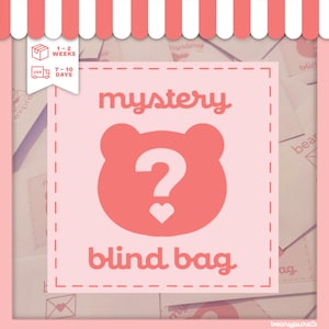 May include: A pink square with the words "mystery blind bag" and a bear-shaped design with a question mark and heart. The background is a collage of pink and white paper. A white and red striped awning is at the top.