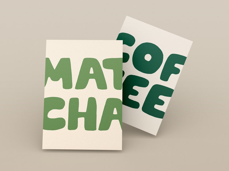 May include: Two cards with green text on a cream background. The text on the top card reads "COFFEE" and the text on the bottom card reads "MATCHA".