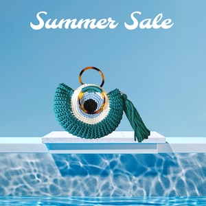 May include: A turquoise crochet handbag with a circular design, featuring a brown handle and a green tassel. The bag has a white and light blue circular pattern in the center, resembling an eye. The words "Summer Sale" are written in white.