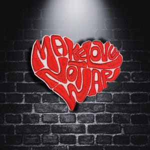 May include: Red embroidered heart-shaped patch with the text "Make Love Not War" in white.