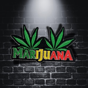 May include: Green marijuana leaf embroidered patch with the word "MARIJUANA" in red, yellow, and green letters.