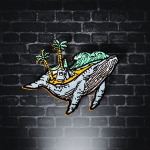 May include: A blue whale with a green wave and palm trees on its back. The whale is carrying a small island with a yellow beach and a small house. The image is a patch or sticker.