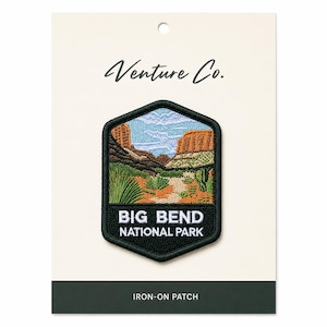 May include: An embroidered patch featuring a desert landscape with the text "BIG BEND NATIONAL PARK." The patch is in a black, green, and tan color scheme, with the words "Venture Co." at the top. The bottom of the card reads "IRON-ON PATCH."