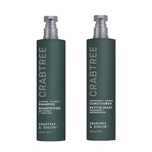 May include: Two dark green Crabtree & Evelyn shampoo and conditioner bottles with silver pump tops. The shampoo bottle reads "Cleanse + Clarify Shampoo" and the conditioner reads "Moisturize + Renew Conditioner". Each bottle is 15 fl oz.