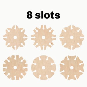 May include: Eight wooden discs with eight slots each. The discs are light brown and have a circular shape. The text "8 slots" is printed above the discs.