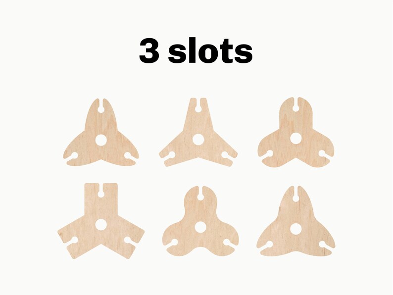 May include: Six wooden wine bottle holders, each with three slots. The holders are in the shape of a triangle with a round hole in the center. The text "3 slots" is printed above the holders.