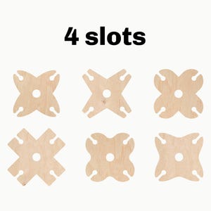 May include: Six wooden wine bottle holders, each with four slots, arranged in two rows of three. The holders are made of light brown wood and have a natural finish.