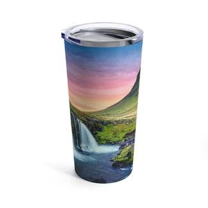 Premium Photo  Thermos with a hot drink on mountain waterfall
