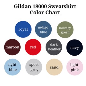 May include: Color chart for Gildan 18000 sweatshirts, showing 12 different colors: royal, indigo blue, military green, maroon, red, dark heather, navy, light blue, sport grey, sand, and light pink.