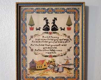 1917 P.F. Volland Framed Print, Needlepoint Sampler "Ain't It Funny"