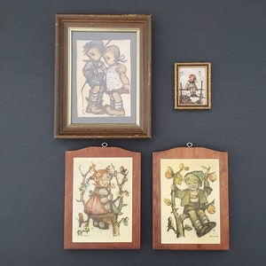 May include: Four framed illustrations of children in various poses. The top left frame features two children, a boy and a girl, standing side-by-side. The top right frame shows a girl standing on a fence. The bottom two frames feature a girl and a boy, each standing in a garden setting.